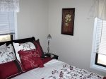 The master bedroom has a queen cherry wood bedroom set and its own bathroom.